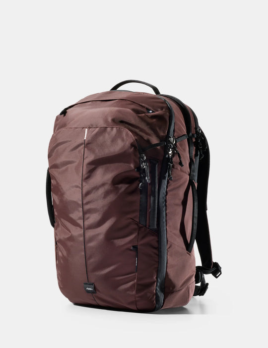 Brown backpack with black straps on a white background