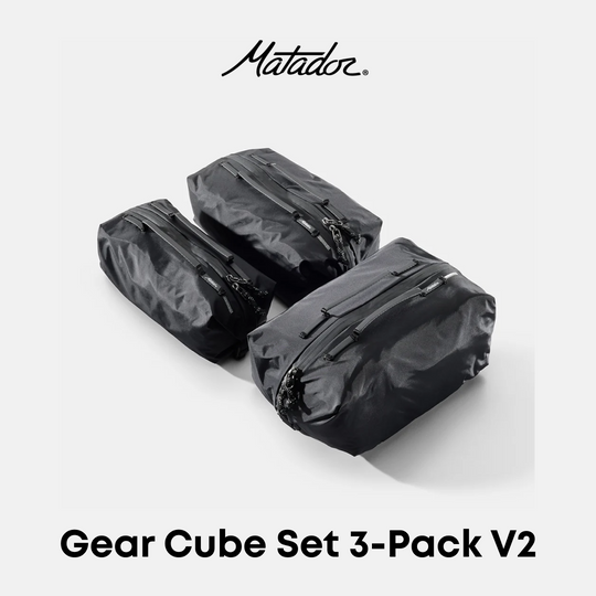 Three black waterproof gear cubes arranged in a set on a light gray background, with the Matador logo at the top and the text &