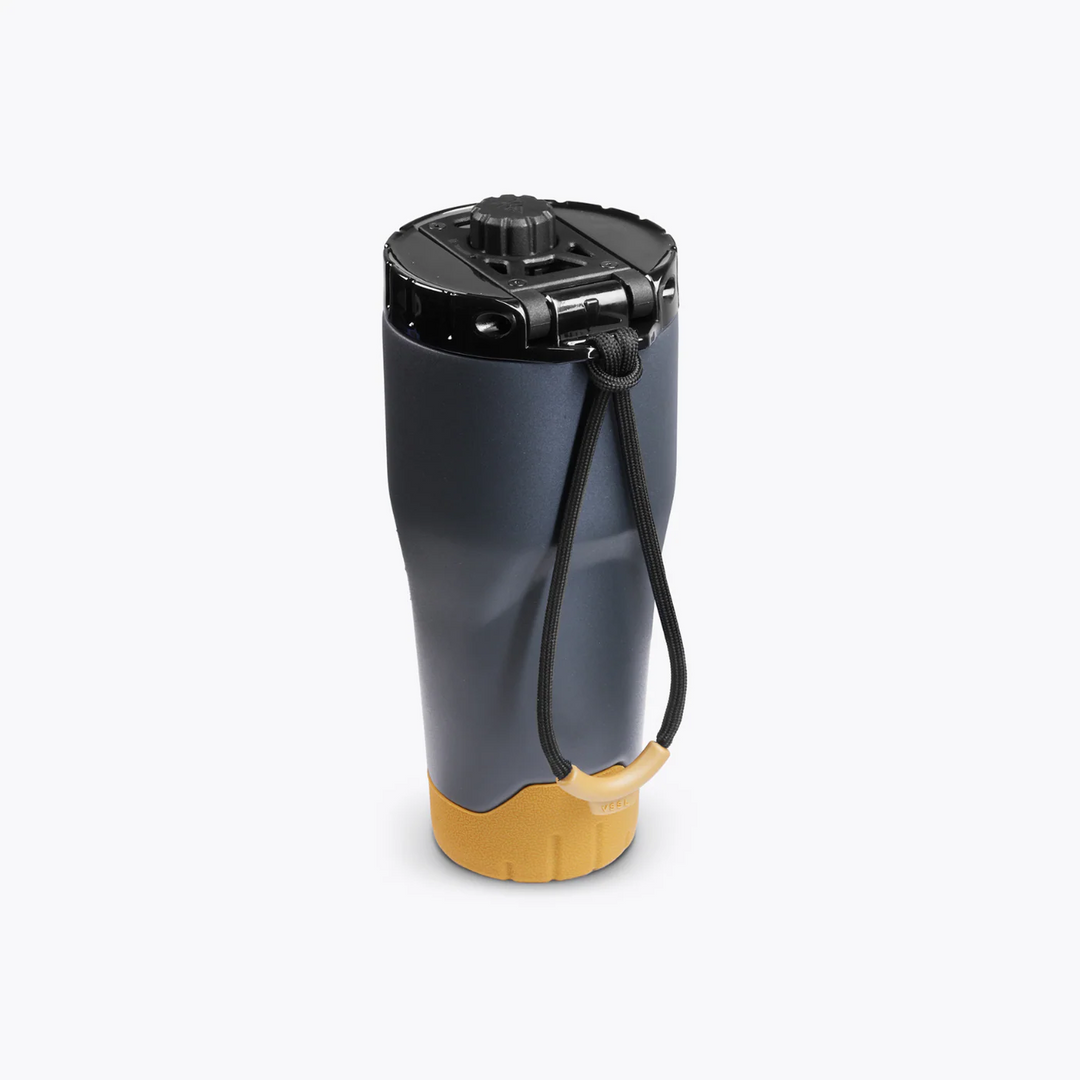Gray and yellow portable water filter on a white background