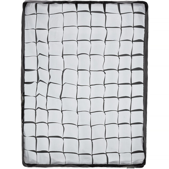 Grid-patterned mat with black and white squares on a white background