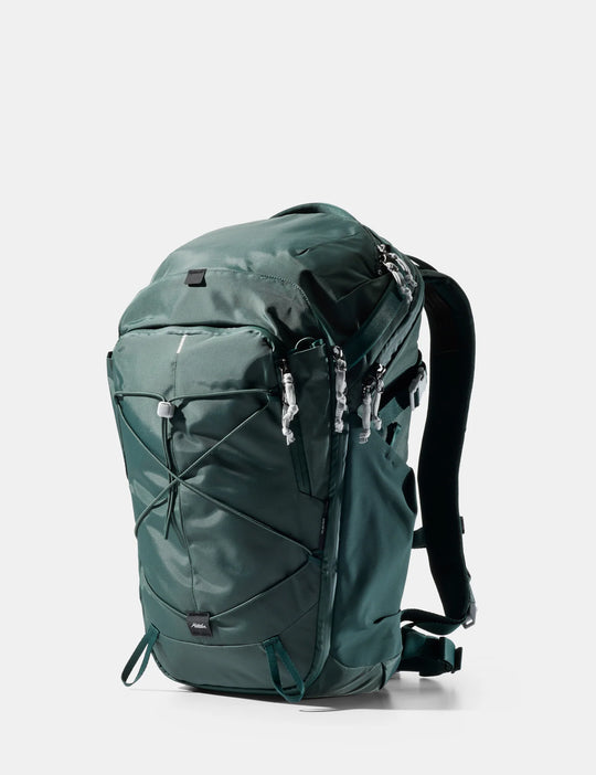 Green backpack on a white background