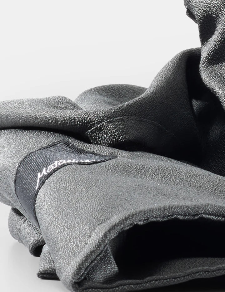 Folded gray fleece blanket with a brand logo on a light gray background