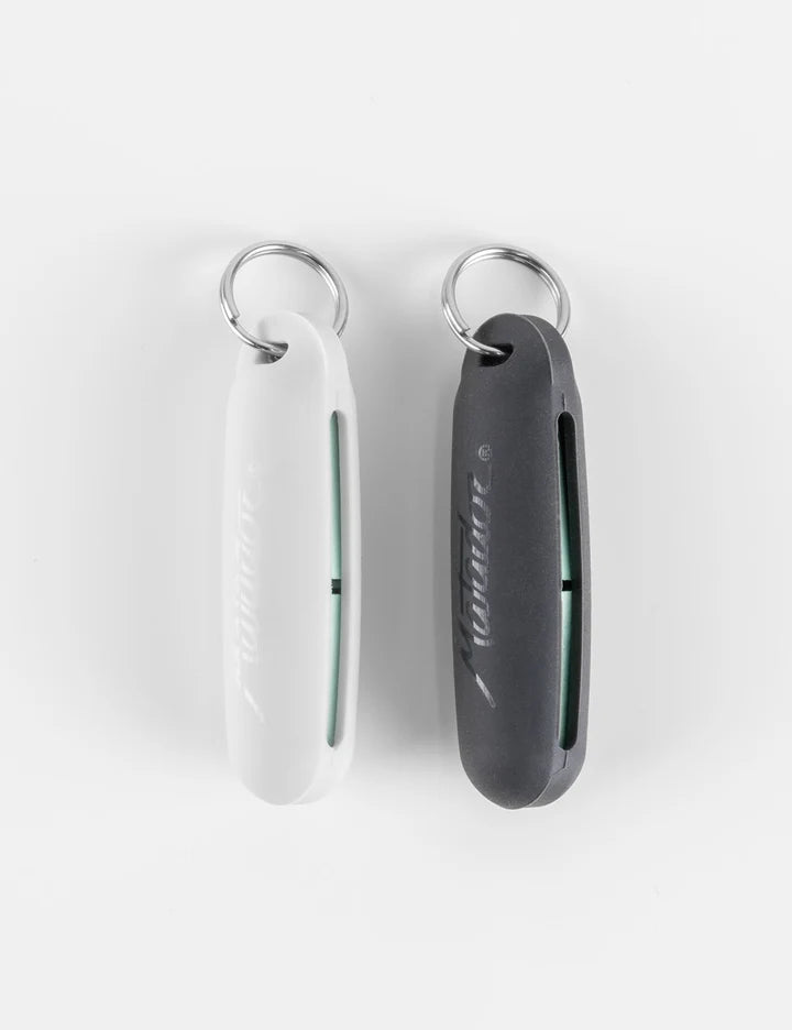Two slim protective keychain cases, one white and one dark gray, each with a silver metal key ring, shown on a clean white background.