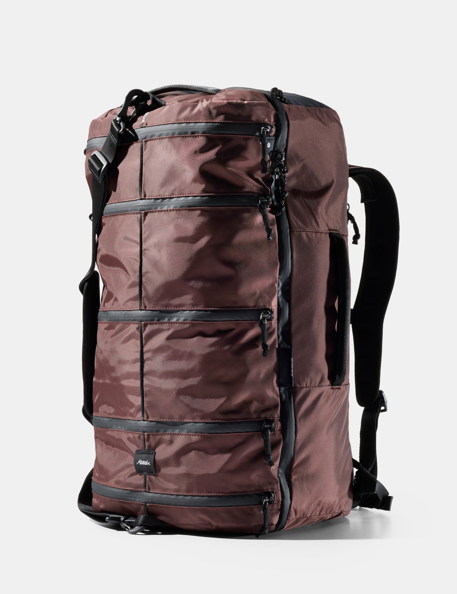 Matador 45L SEG Hybrid Travel Pack backpack in black, shown from a three-quarter front view on a light gray background with the brand name 'Matador' at the top and '45L SEG Hybrid Travel Pack' at the bottom.