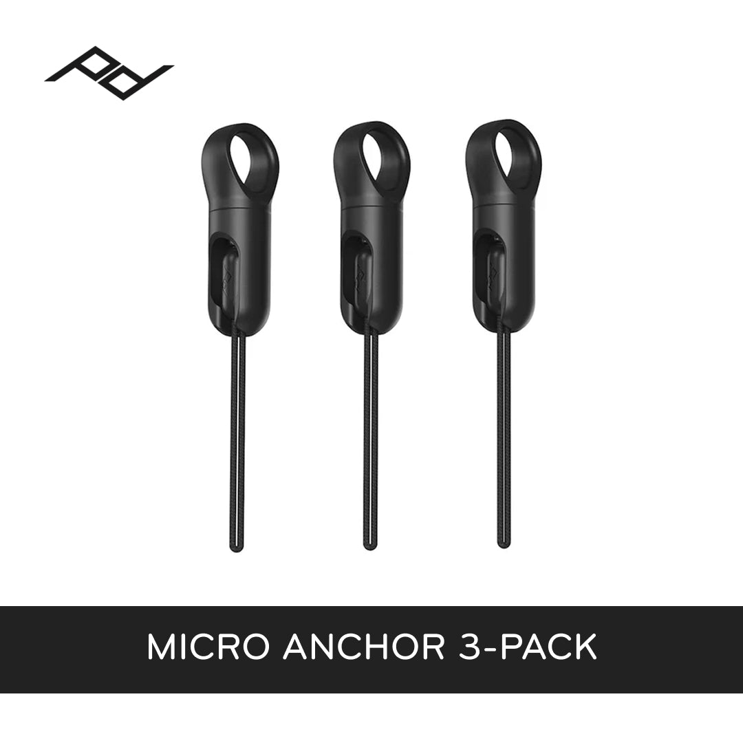 Three black micro anchors with peak design logo on a white background