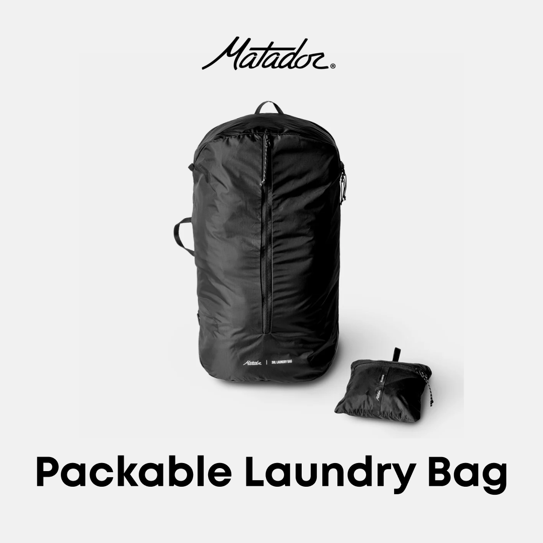 Black packable laundry bag with Matador branding on a white background