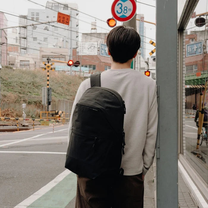 Person carrying Peak Design 22L City Backpack
