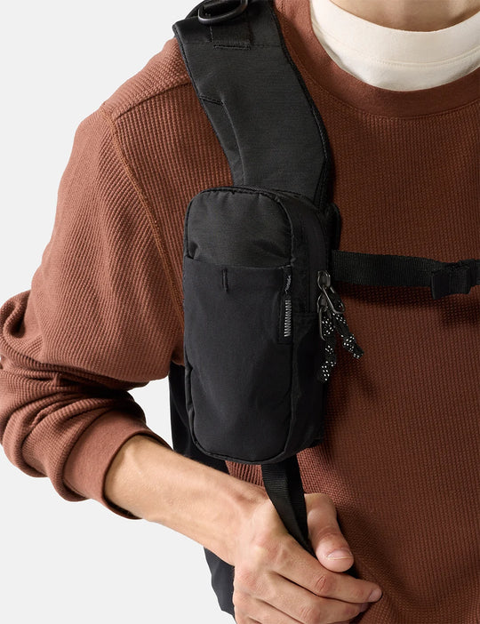 Person wearing a black matador speed stash pocket on a plain background