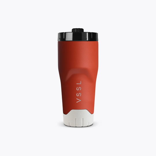 Red travel mug with black lid on a white background