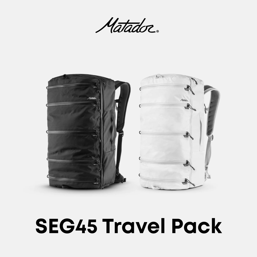 Two Matador SEG45 Travel Packs, one black and one white, displayed upright with the brand name and product name visible.