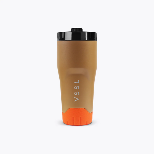 Brown and orange tumbler with black lid on a white background