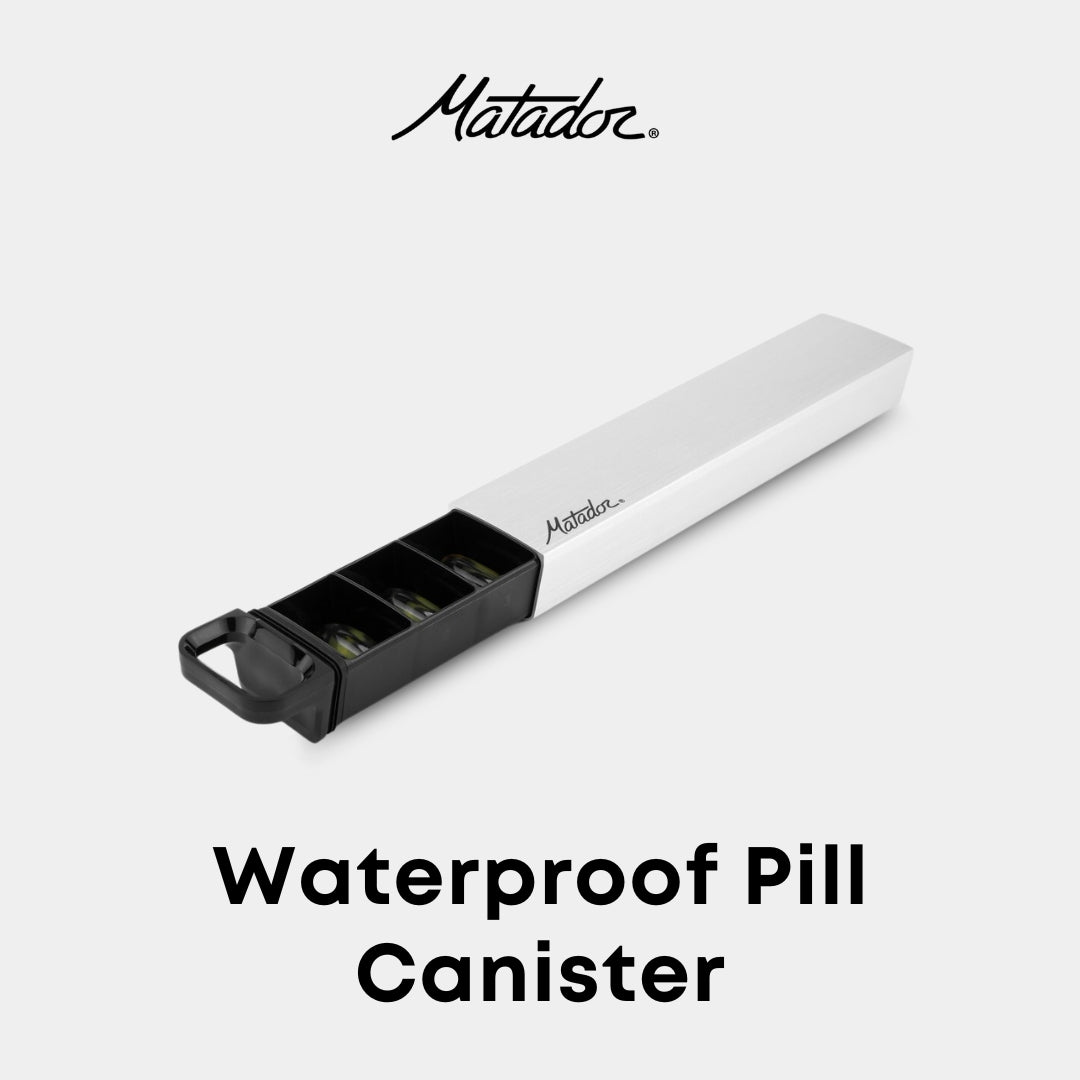 A waterproof pill canister with a crush-proof aluminum shell, featuring a sliding insert with 7 numbered slots for organization, and the Matador brand logo.