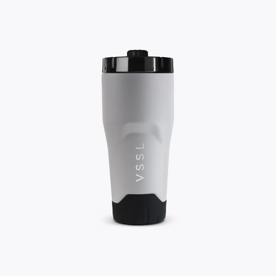 Gray tumbler with black lid and bottom on a white background