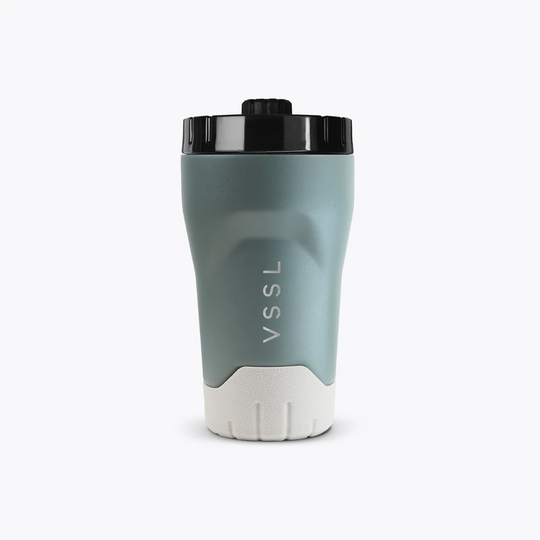 Gray and white travel mug with black lid on a white background