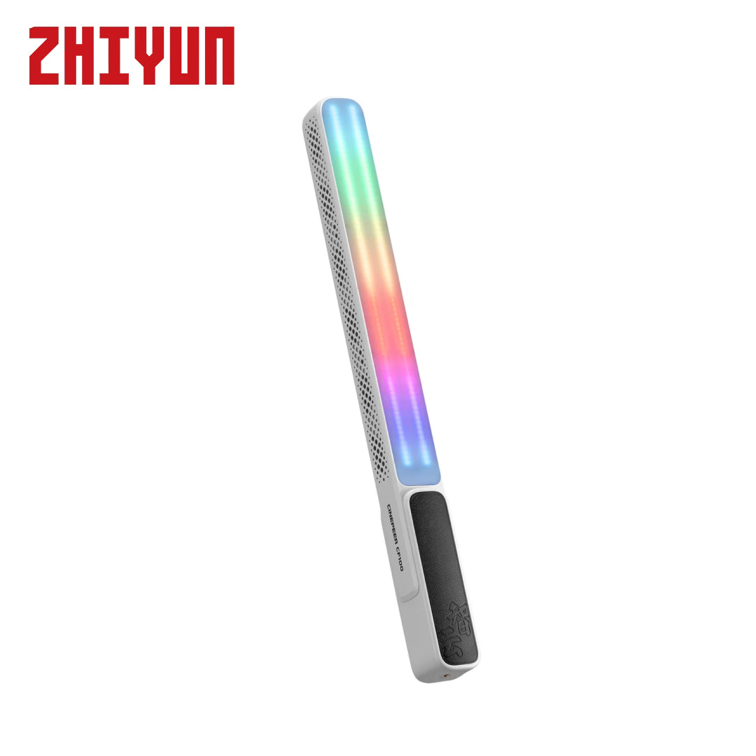 A slim rectangular LED light stick by ZHIYUN, featuring a white body with a black textured grip and a vibrant RGB rainbow light bar glowing in the center, set against a plain white background.