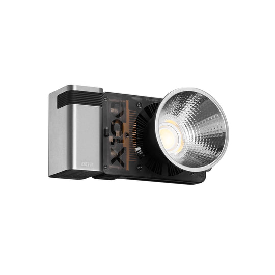 A modern LED light bar with a brushed silver metal housing, black accents, and a large silver reflective lens, shown against a plain white background.
