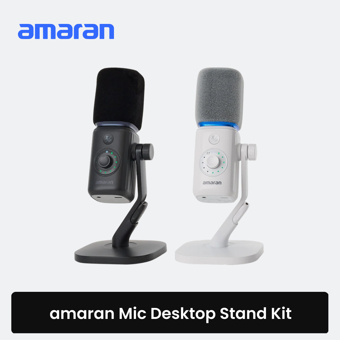 Side-by-side view of the amaran Mic Desktop Stand Kit featuring black and white USB microphones with windscreens mounted on adjustable desktop stands against a light background.