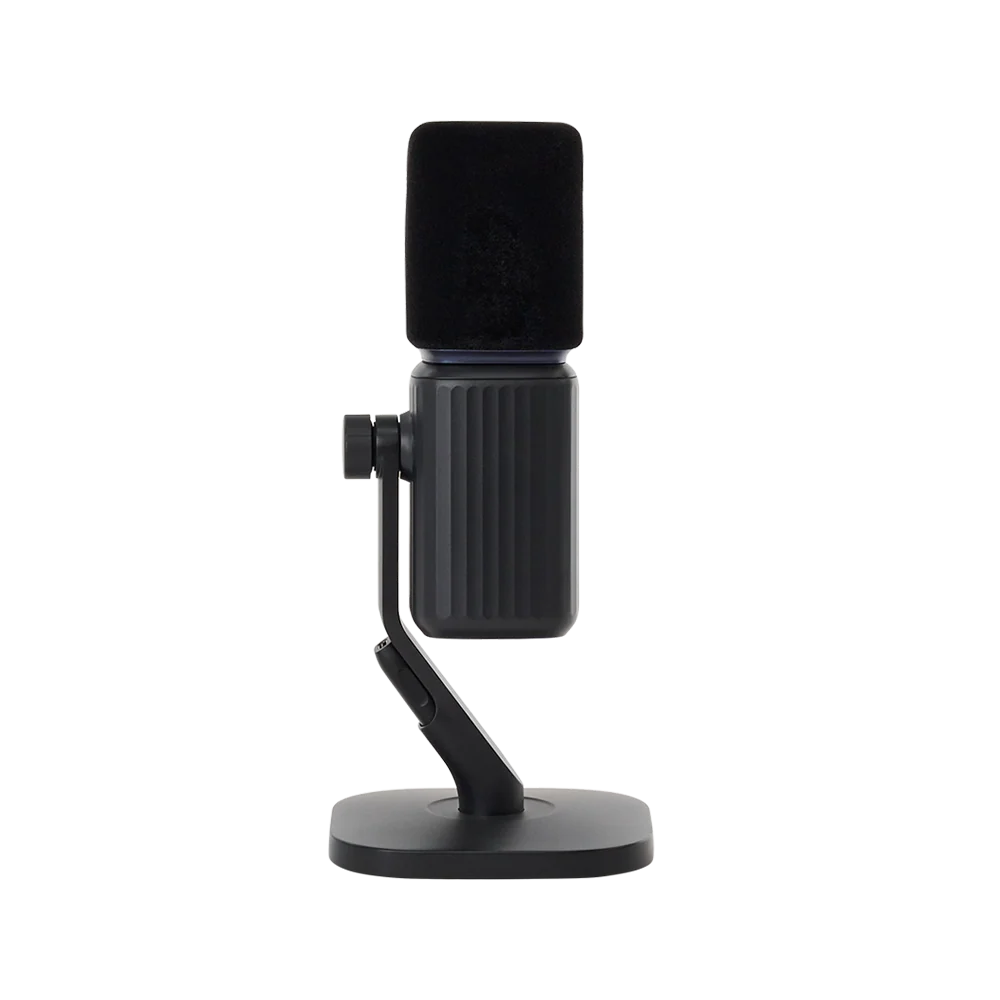 Rear profile view of the black amaran Mic Desktop Stand Kit showing the ribbed microphone body casing, mounting knob, and desktop stand assembly against a transparent background.