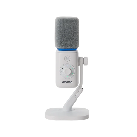 Direct front view of the white amaran Mic Desktop Stand Kit showing the grey foam windscreen, mute button, gain adjustment dial with LED indicator ring, and desktop stand against a transparent background.
