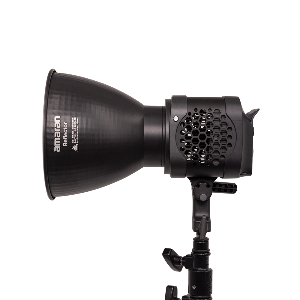 Black studio light with honeycomb grid and 'amanan' branding on a white background