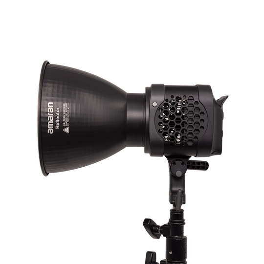Black studio light with honeycomb grid and 'amanan' branding on a white background