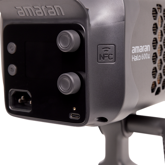 Close-up of a lighting device with 'amaran' branding on a white background