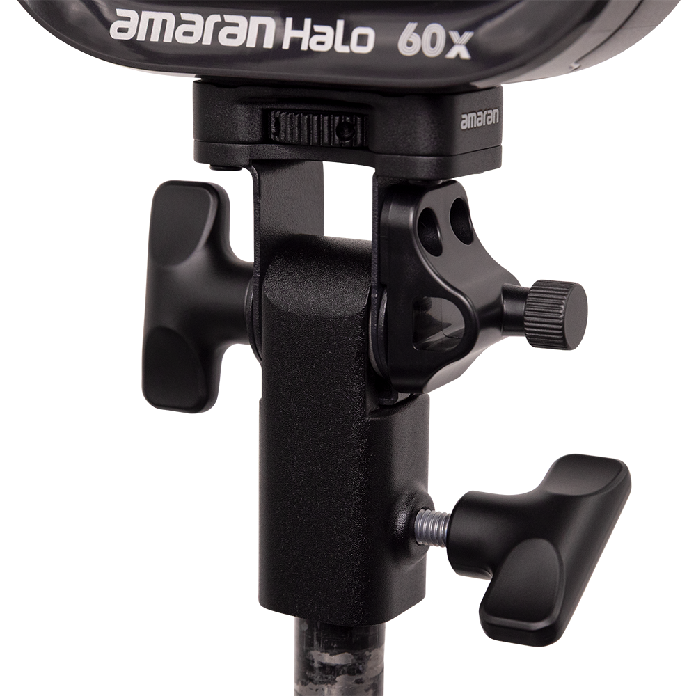Close-up of a lighting stand with an 'amaran' branded light fixture on a white background