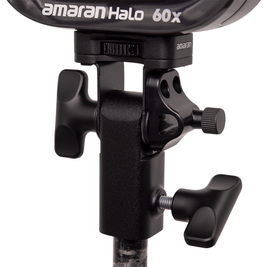Close-up of a lighting stand with an 'amaran' branded light fixture on a white background