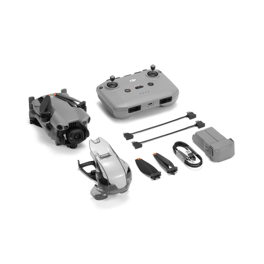 Collection of drone parts including body, controller, propellers, and accessories on a white background