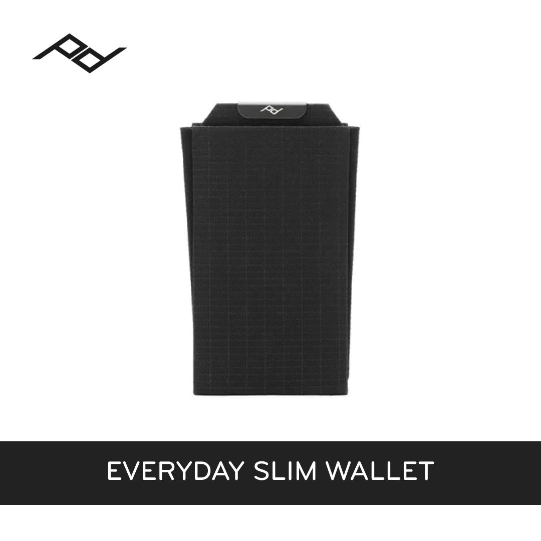 Black slim wallet on a white background with 'peak design' brand logo.