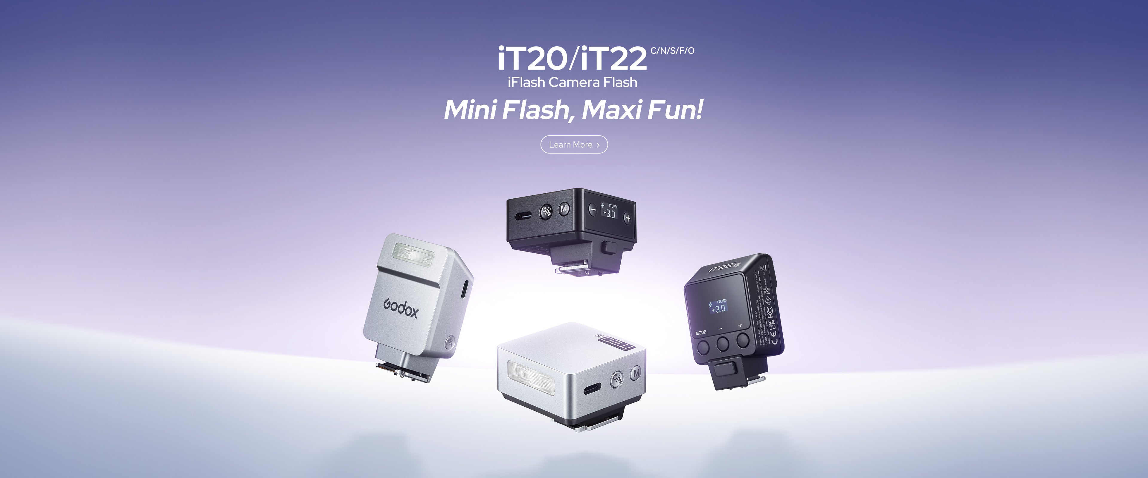 A promotional image displays four compact camera flashes against a purple and blue background. Two flashes are black and two are silver, shown from different angles. Text at the top reads