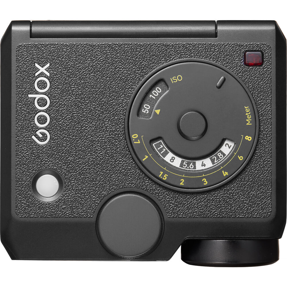 Close-up view of the front panel on the Godox Lux Junior II Retro Camera Flash showing the retro-style analog exposure calculator dial with ISO, aperture, and meter markings set against a leatherette finish.