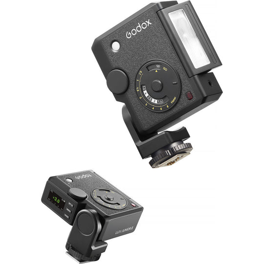 Product shot featuring two views of the Godox Lux Junior II Retro Camera Flash, displaying the front analog calculation dial with tilted flash tube alongside the rear active LCD control display and side pivot mechanism.