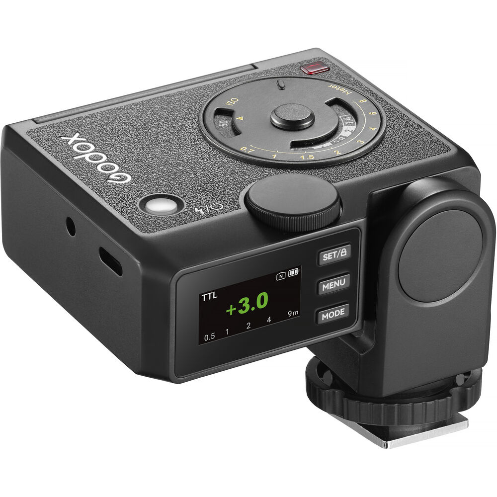 Rear high-angle perspective of the Godox Lux Junior II Retro Camera Flash showing the active LCD control screen, USB-C charging port, top control wheel, analog calculation dial, and hot shoe locking wheel base.