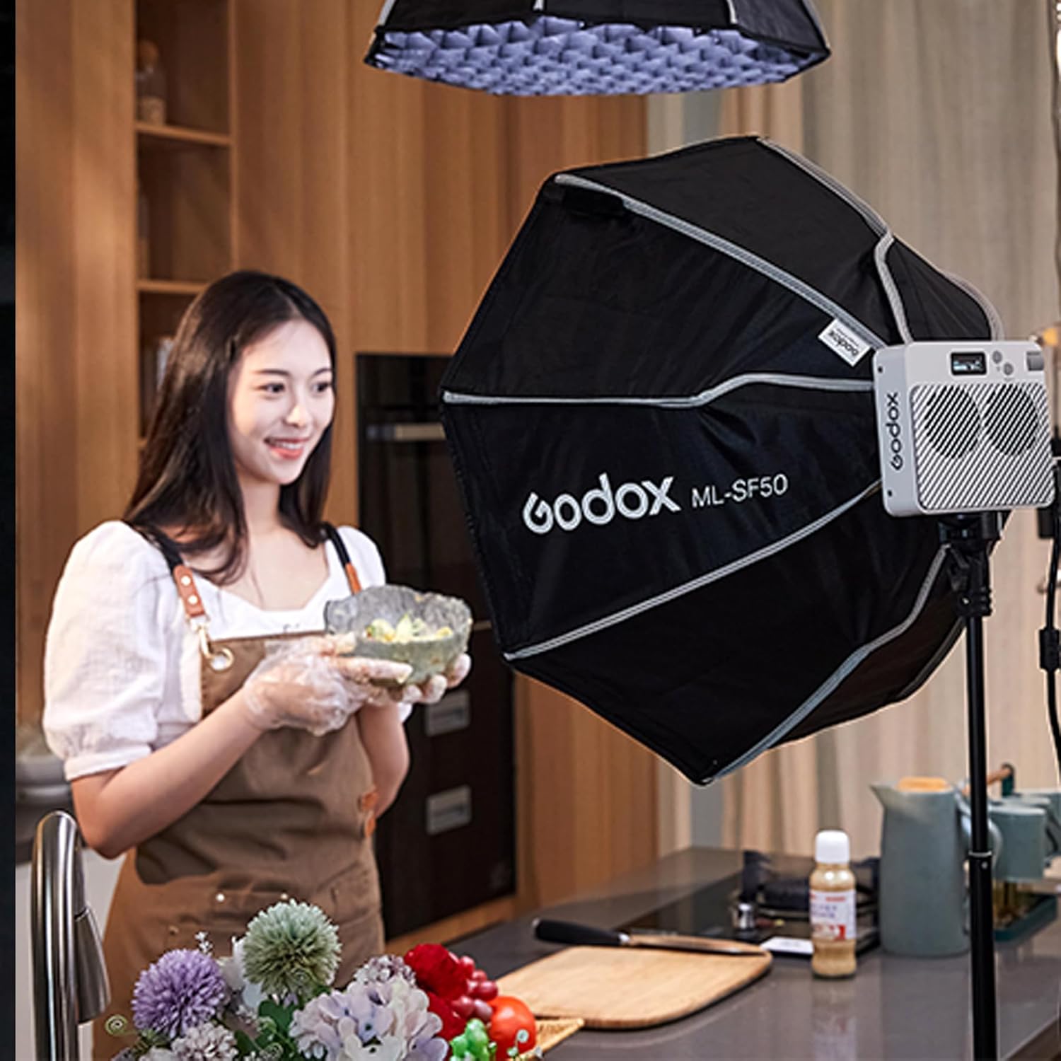 Godox ML-J50 softbox studio light modifier, black with white logo text, shown on a white background with an orange Godox brand border.
