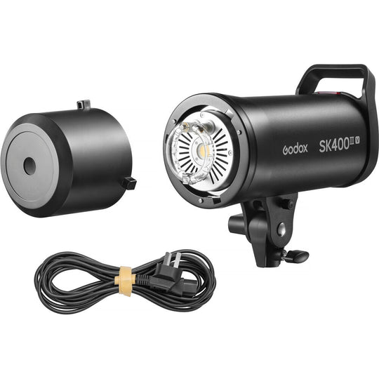 Godox SK400III-V studio flash strobe with included protective lamp cover and power cable.