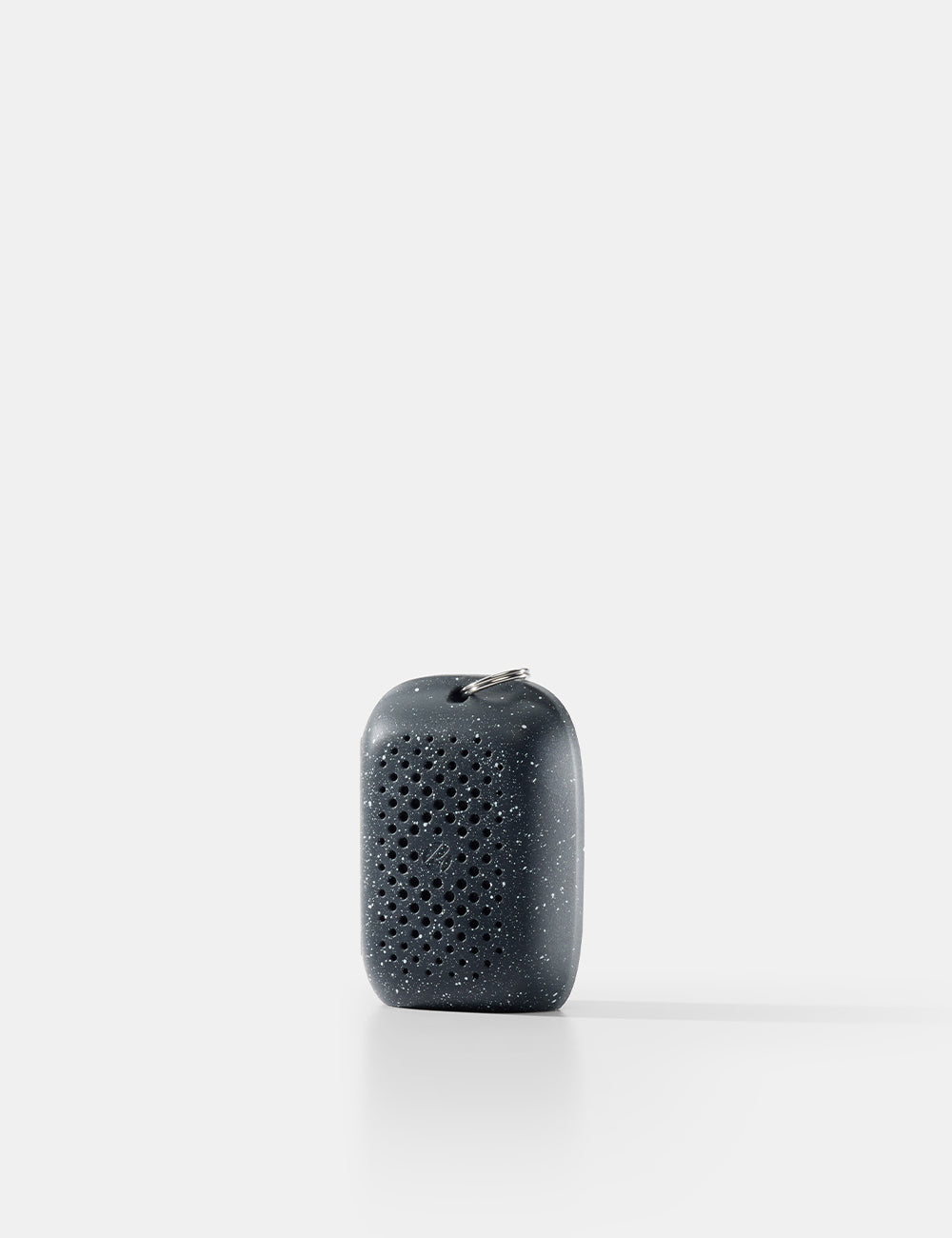 Black textured object on a white background