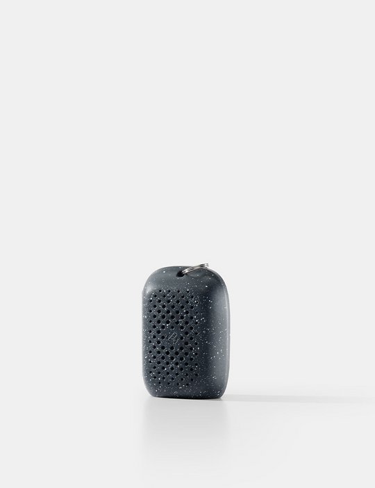 Black textured object on a white background