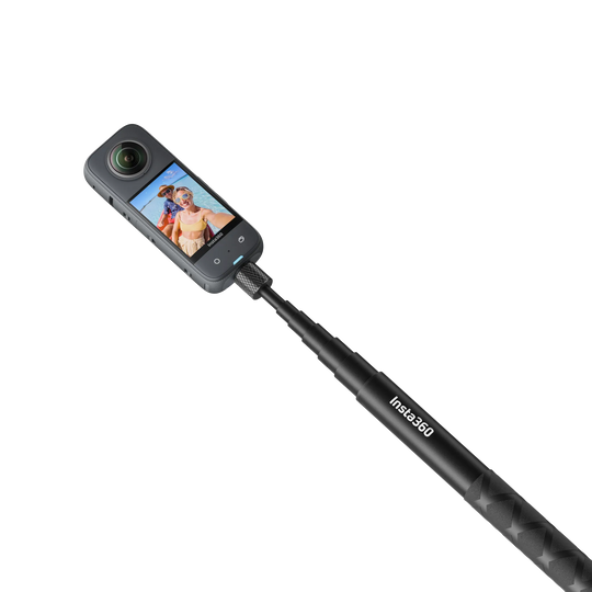 Studio product view of an Insta360 X3 action camera mounted on top of the extended Insta360 114cm Invisible Selfie Stick on a transparent background.