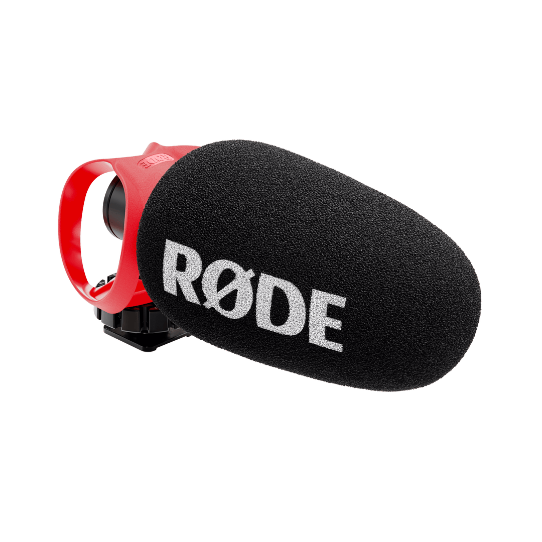 Rode microphone with black foam cover on a white background