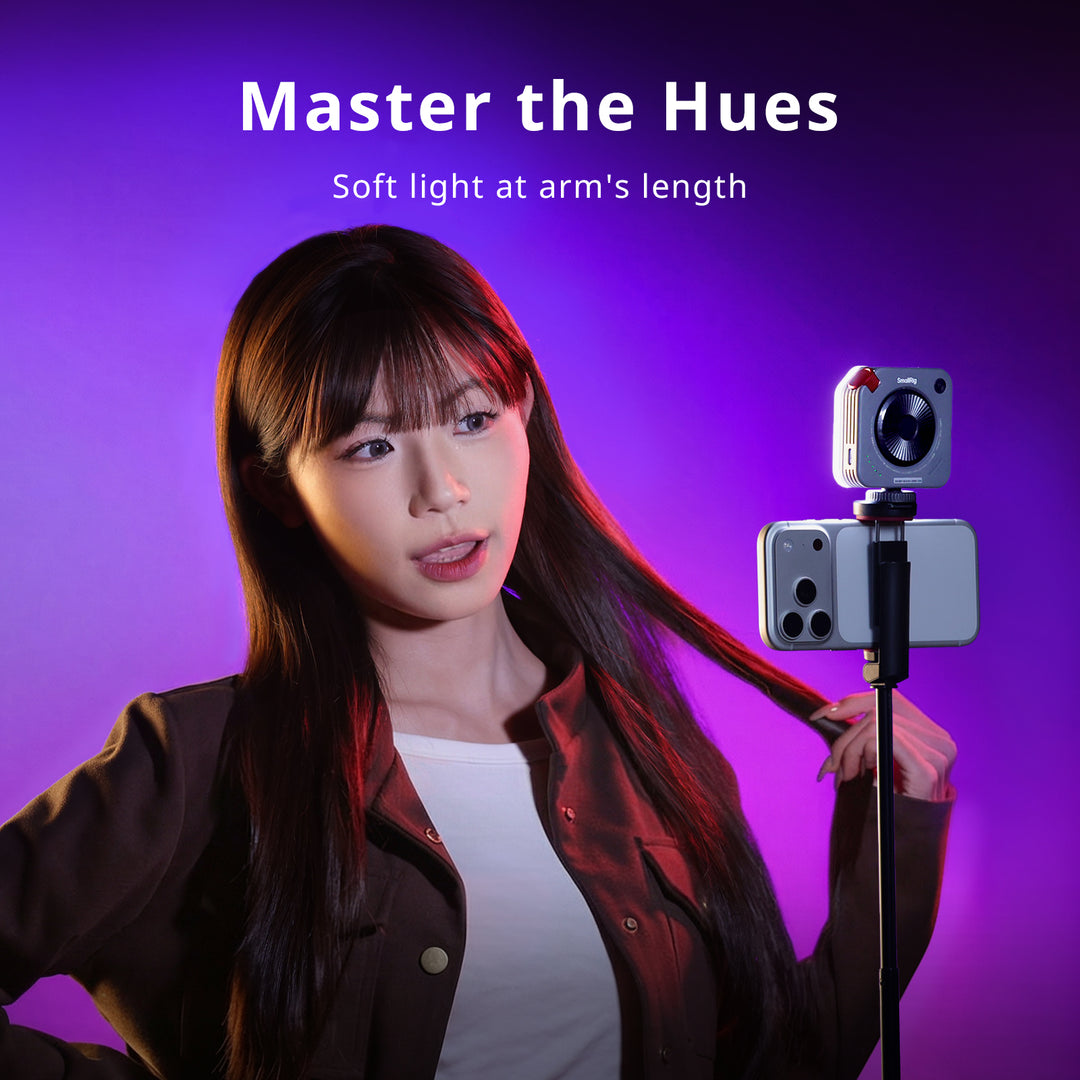 SmallRig mini LED light mounted on a smartphone stick setup for mobile content creation, with the headline "Master the Hues.