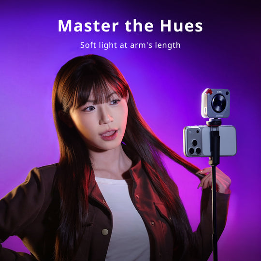 SmallRig mini LED light mounted on a smartphone stick setup for mobile content creation, with the headline "Master the Hues.