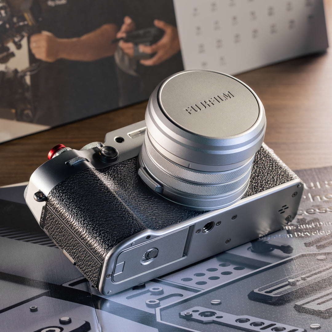 SmallRig UV filter and lens hood kit with original lens cap attached to silver FUJIFILM X100VI camera.