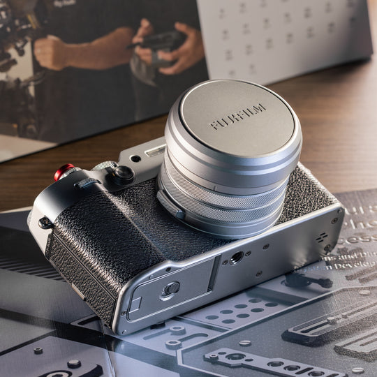 SmallRig UV filter and lens hood kit with original lens cap attached to silver FUJIFILM X100VI camera.