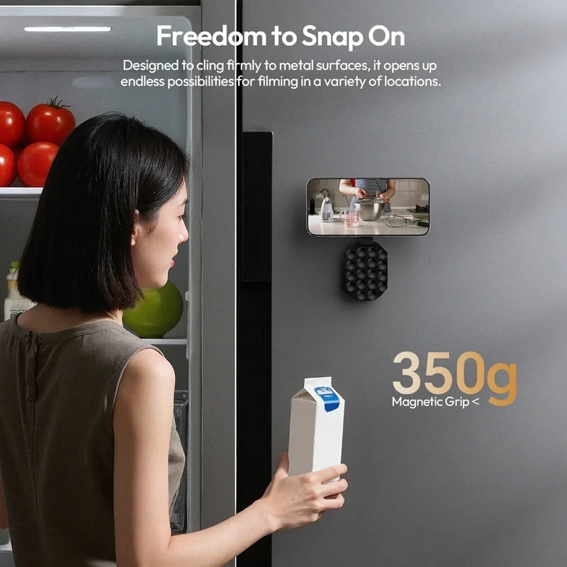 Ulanzi MA39 MagLock suction mount attached to a metallic refrigerator surface supporting up to 350g magnetic grip for filming.