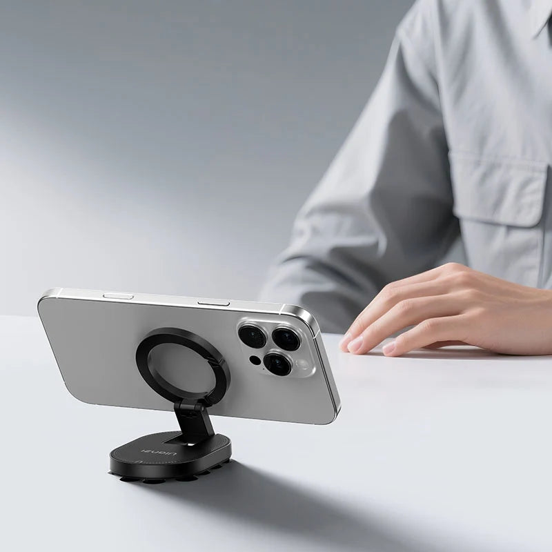 Ulanzi MA39 MagLock suction mount placed on a desk holding an iPhone in landscape mode as a desktop stand.