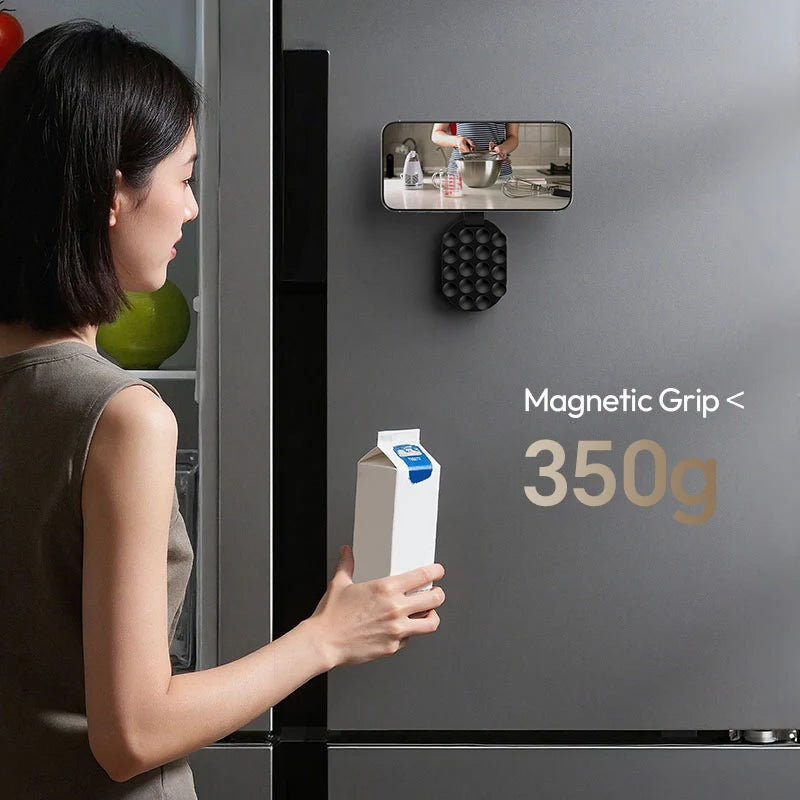 Ulanzi MA39 MagLock suction mount attached to a metallic refrigerator surface supporting up to 350g magnetic grip for filming.