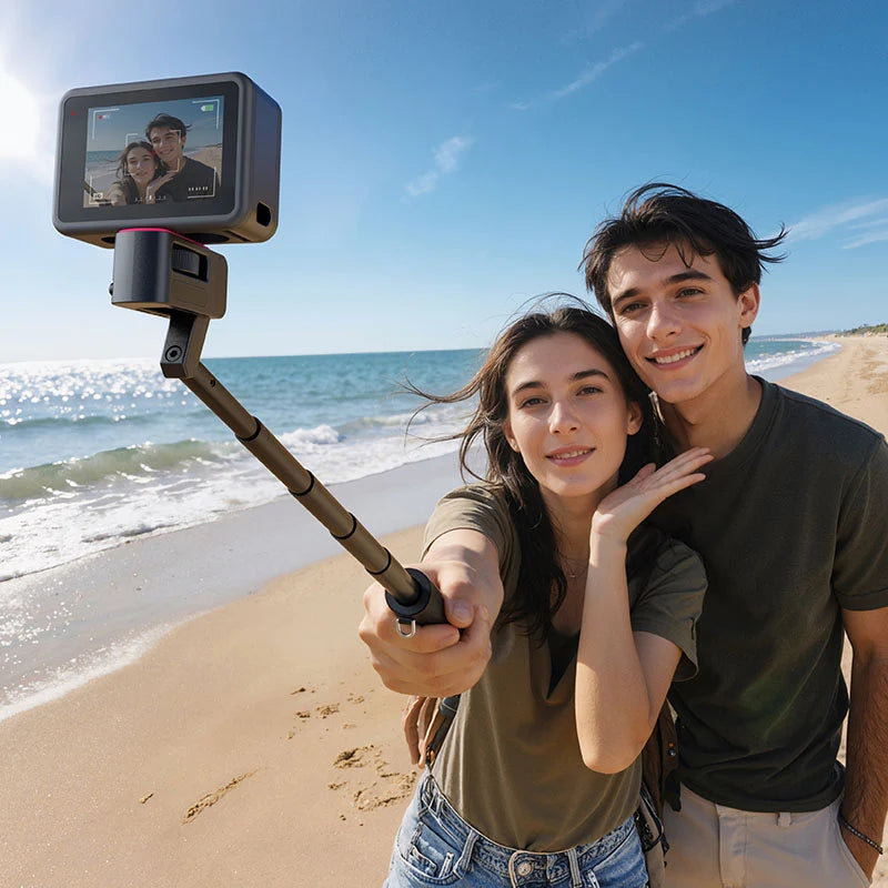 Young couple taking a beach selfie with an action camera mounted on the Ulanzi MT98 foldable selfie stick.
