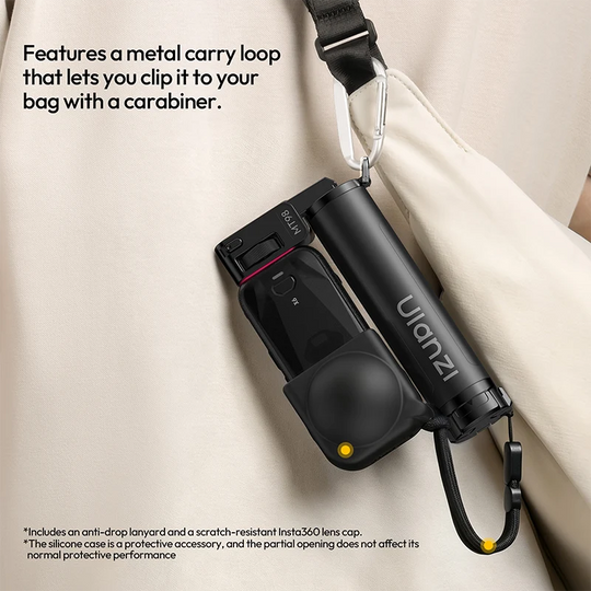 Ulanzi MT98 selfie stick attached to a shoulder bag strap via its integrated metal carry loop and carabiner clip.