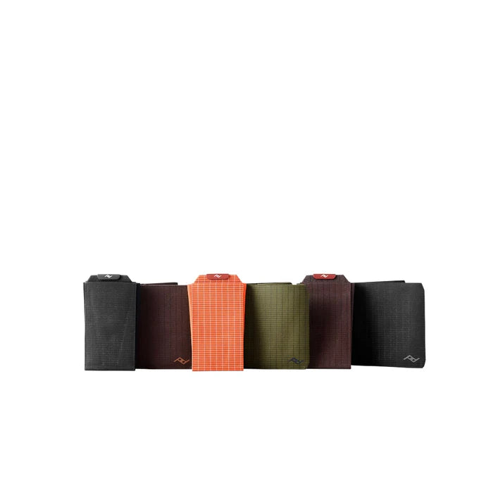 Set of six fabric rolls in various colors on a white background